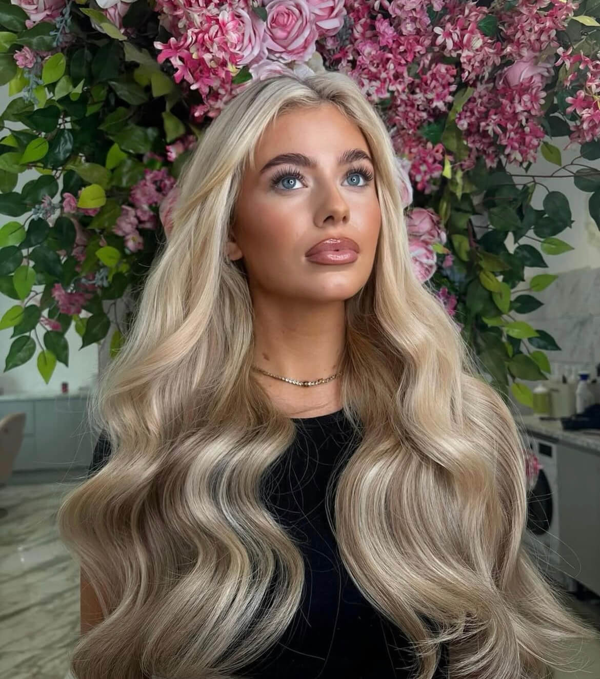 model posing with pretty flowery background